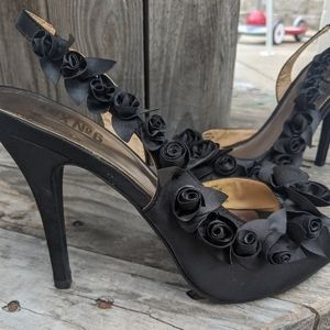 Black heels with flowers down the sides